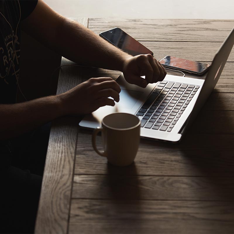 A person typing on a laptop